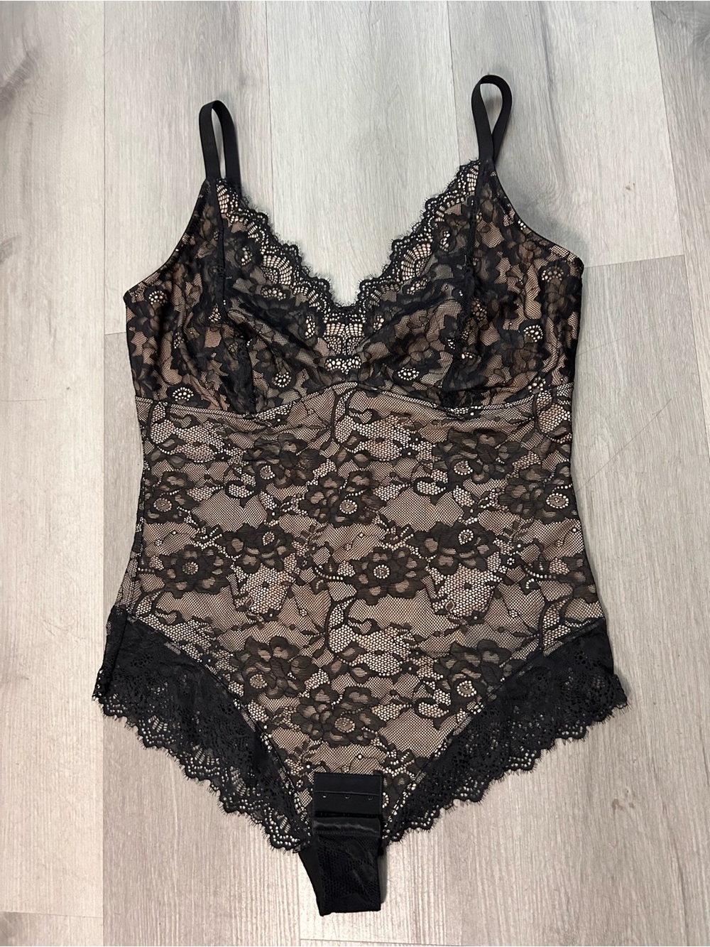Black Lace V-Neck Bodysuit with Sheer Floral Design